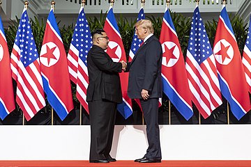 360px-Kim_and_Trump_shaking_hands_at_the_red_carpet_during_the_DPRK–USA_Singapore_Summit.jpg