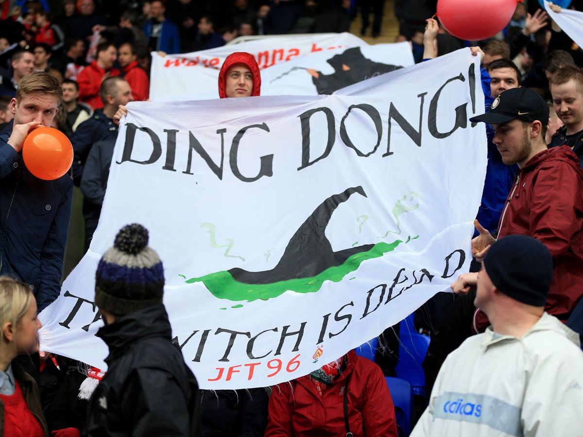 Liverpool-fans-hold-up-a-banner-about-the-death-of-Margaret-Thatcher.jpg